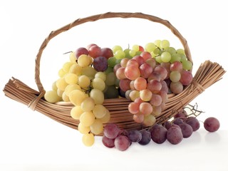 pink and red grapes in basket