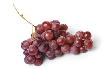 Red ripe grape on the white background