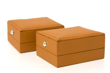 two brown boxes for jewelry