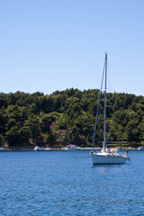 Sailing Yacht in Blue Bay