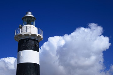 Fari Sardegna e nuvole