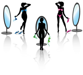 Sexy woman before a mirror with bikini