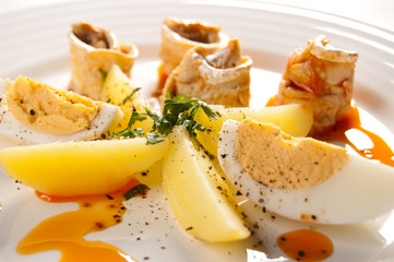 Marinated herring fillets, eggs and potatoes