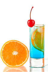 Alcohol cocktail with blue curacao, orange and maraschino