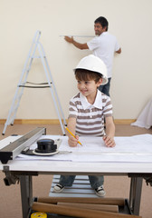 Father and son studying architecture at home