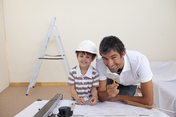 Father and son refurbishing a bedroom