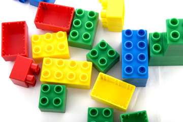 vibrant collection of plastic building blocks in white background