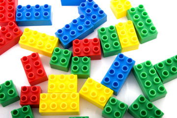 vibrant collection of plastic building blocks in white background