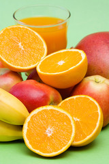 glass of fresh juice and fresh fruits