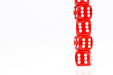 A set of five red dice with white dots arranged on a white background. Perfect for representing...