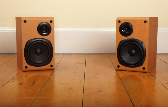Stereo Speakers on Wooden Floor
