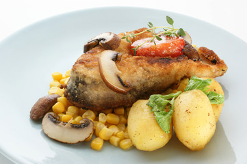 carp steak on organic potato and lemon
