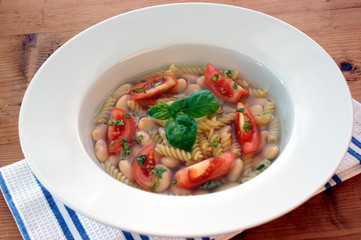 mediterranean noodle soup with white beans and tomato
