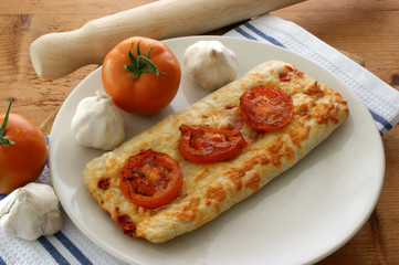 stone oven baked pizza with organic tomato