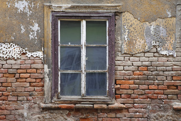Fototapeta na wymiar Old window with plaster and brick wall in Zagreb Croatia