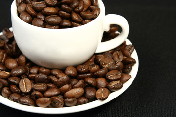 coffee time, a cup of beans on a black background