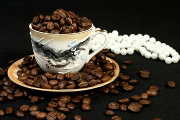 coffee beans in a cup of oriental style and beads