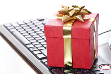 Red gift box on computer keyboard