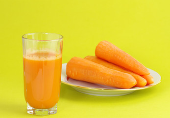glass with juice and carrot