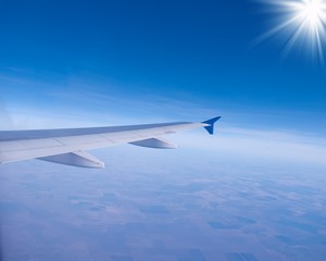 Obraz premium sky sun clouds plane wing