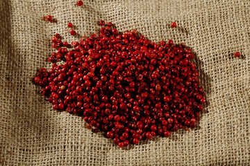 red peppercorns on sack cloth