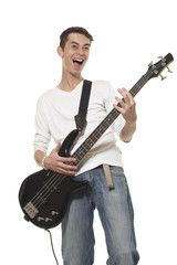 Obraz premium The young guy with a bass guitar on a white background.