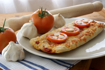 stone oven baked pizza with organic tomato