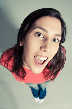 Close-up Of A Cheerful Young Woman Looking Up Top View