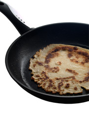 pancake cooking in a pan.