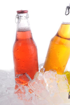 bottles with  drink in ice