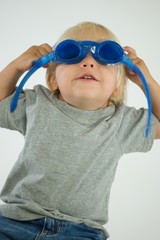 Blond Boy Putting on Goggles