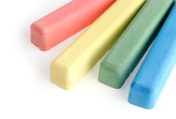 Colorful chalks on white background