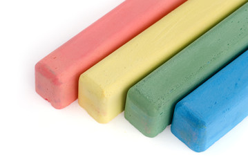 Colorful chalks on white background