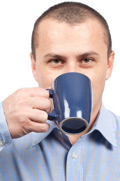 Young businessman enjoying a cup of coffee
