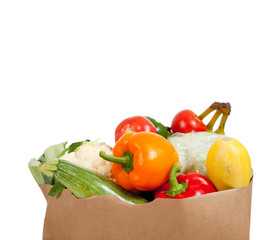 Paper grocery sack with vegetables on white