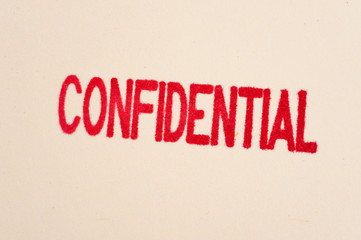 Red confidential stamp on a folder