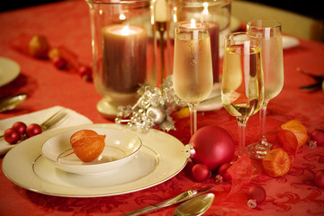 Elegant Christmas table setting in red and gold colors
