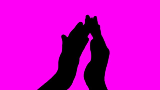 Hand clap in silhouette against pink - HD
