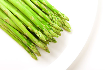 Asparagus on white plate