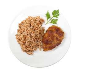 chops with buckwheat on plate.