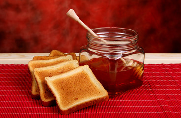 Jar of honey and toasts