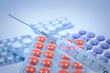 Syringe and tablets.