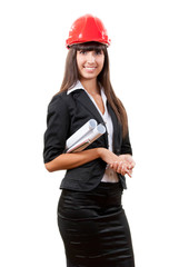 Smiling businesswoman wearing red helmet