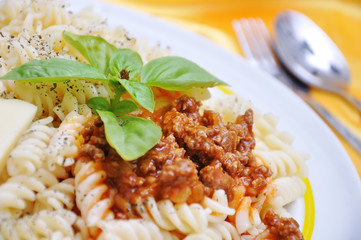 Italian macarony with original ingredients, on golden fabric