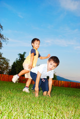 Children playing on meadow