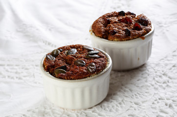 Two muffins in white cup