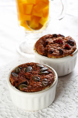 Two muffins in white cup