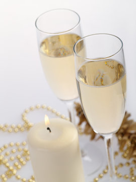 Two champagne glasses on the grey background