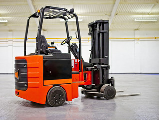 Fork Lift Truck in empty Warehouse