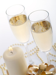 Two champagne glasses on the grey background